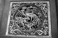 Image 63Relief of a fenghuang in Fuxi Temple (Tianshui). They are mythological birds of East Asia that reign over all other birds. (from Chinese culture)