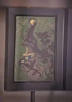 Coat of arms. The text says: Nul bien sans peine ("No good without effort" or "No pain, no gain")