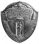 Black and white photograph of a silver challenge shield