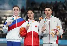 Pommel horse victory ceremony (from left to right): Sergei Naidin (Silver), Yin Dehang (Gold), Reza Bohloulzadeh (Bronze)