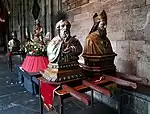 Processional litters with busts of Bartholomew, Hubert & others, cloisters of Our Lady's