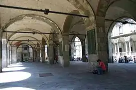 Under the porch of Broletto Nuovo in Milan