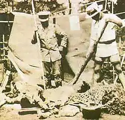 Koreans in Japan about to be stabbed by Japanese vigilantes with bamboo spears immediately after the Kanto earthquake.