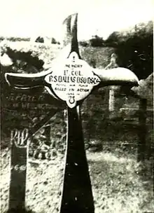 Crucifix, made from an aeroplane propeller, in a cemetery. The inscription reads "Lt. Col. R.S. Dallas DSO DSC ... Killed in Action" 1 June 1918