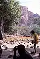 A schoolboy between the sitting stones of the Tireli market, Mali 1984