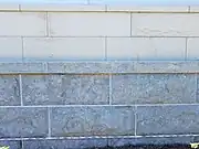 Americus Limestone: Grey contrasting with the buff Cottonwood Limestone.