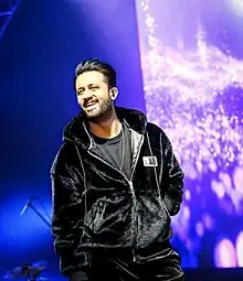 Aslam singing at a event in Pakistan .