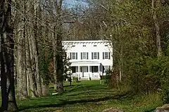 Tree-lined former driveway from Oldwick Road