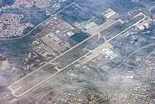 Royal Brunei Air Force Base, Rimba (top left) shares its 3,685 metres (12,090 ft) runway with the Brunei International Airport (bottom right), 2016.