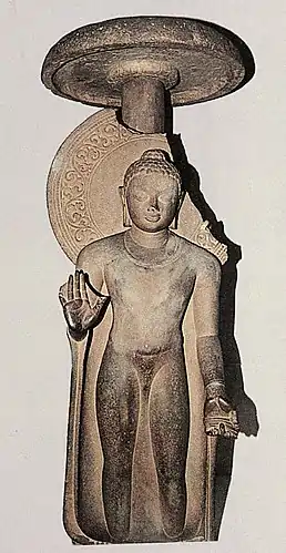Buddha, standing under a chatra umbrella, inscribed: "Gift of Abhayamira in 154 GE" (474 CE) in the reign of Kumaragupta II. Sarnath Museum.
