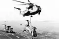 CH-53 lifts a CH-46 from USS Inchon in 1977.