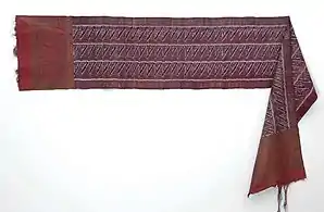 Chest cloth. Silk breast cloth is decorated with a tie in the weft and additional weft of gold thread (songket). This cloth decorated with gold threads is mainly used on celebratory occasions, the silk breast cloth with a motif is applied to weft in Sumatra, circa 1900 (Tropenmuseum, Netherland).