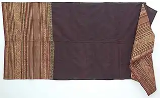 Fabric. Silk clothes for women decorated with additional weft motif from gold thread (songket). Silk cloth for women in Sumatra c. 1900.