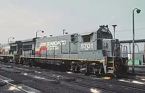 EMD Blomberg B trucks on a GE U36B