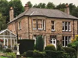 The red-brick front facade of the Deming Armory