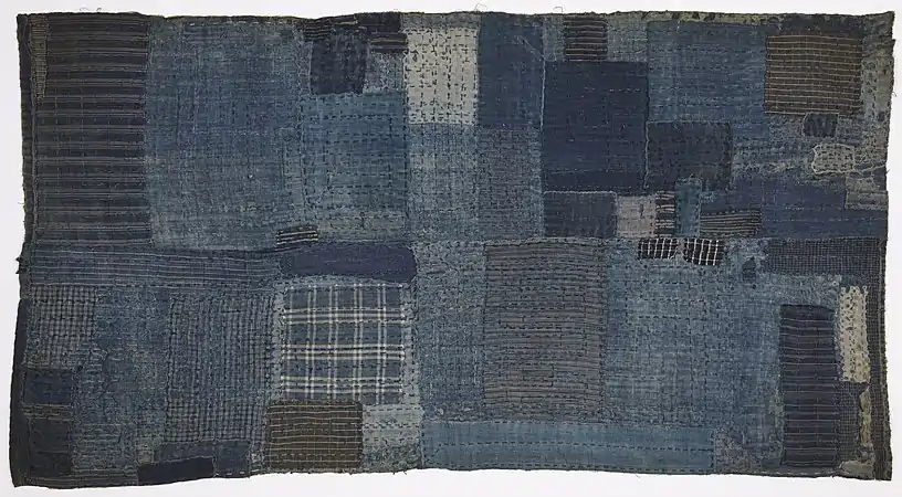 Child's shikibuton (sleeping mat), late 1800s. Boroboro (patchwork) quilted together with over-all sashiko (decorative stitching).