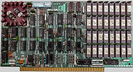 1970s Cromemco 16KZ, a 16KB DRAM memory S-100 bus card. The green round disc parts are decoupling capacitors.