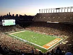 A football game and crowd in a stadium