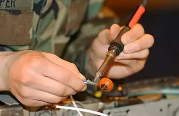 San Diego (Jan. 4, 2007) Navy Diver 1st Class Josh Moore welds a repair patch on the submerged bow of amphibious transport dock USS Ogden (LPD 5) while the ship was in port at Naval Base San Diego.