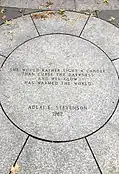 Granite medallion inscribed with Adlai Stevenson's quote, designed by Michael Dwyer.