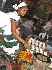 Image 4An Ethiopian woman preparing Ethiopian coffee at a traditional ceremony. She roasts, crushes, and brews the coffee on the spot. (from Culture of Africa)