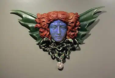 Art Nouveau mascaron-shaped breast ornament, designed by Wilhelm Lucas von Cranach, engraved by Max Haseroth, 1902, gold, opal, nephrite, jasper, emeralds, and pearl, Kunstgewerbemuseum Berlin