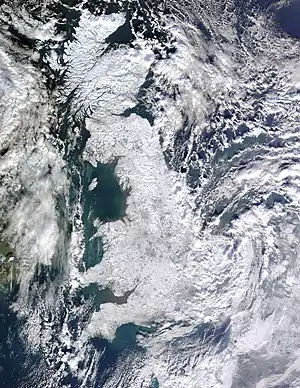 Image 10Winter of 2009–2010 in EuropePhoto: Jeff Schmaltz, MODIS Rapid Response Team, NASAA satellite photo of Great Britain and part of Ireland showing the extent of snow cover during the winter of 2009–2010, the coldest in Europe since 1981–82. Starting on 16 December 2009 a persistent weather pattern brought cold moist air from the north with systems undergoing cyclogenesis from North American storms moving across the Atlantic Ocean to the west, and saw many parts of Europe experiencing heavy snowfall and record low temperatures.More selected pictures