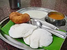 Image 50Idli served with typical accompaniments. (from Malaysian cuisine)