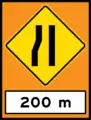 Road narrows on left (temporary sign)