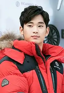 A photograph of Kim Soo-hyun looking at camera