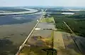 Aerial photograph of the first bay opening on the Morganza Floodway on 14 May 2011. The Mississippi River is in the upper left background, and the Atchafalaya Floodway to the right.