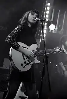 Natalie McCool performing at a show.