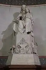 Christ with the Virgin Mary. On the base, the sculptures depict the tools of different profeseions. by Joseph Lefèvre,