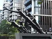 The sculpture in 2015, with One Hyde Park in the background