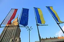 The flag of Poland, the European Union and two Ukrainian flags in central Warsaw; after the Russian invasion of Ukraine.
