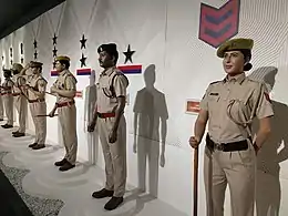 Mannequins in khaki uniforms