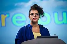 A headshot of Hasters speaking at a conference on June 9, 2022