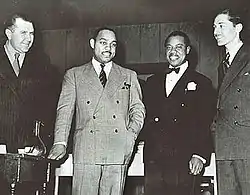 Robert Goffin, Benny Carter, Louis Armstrong, and Leonard Feather (L to R) in 1942