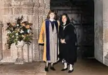 Ros Morpeth and Helen Lentell stand outside Ely Cathedral at Morpeth's degree ceremony where she was awarded an Honorary Doctorate for her contribution to distance learning in 1994.