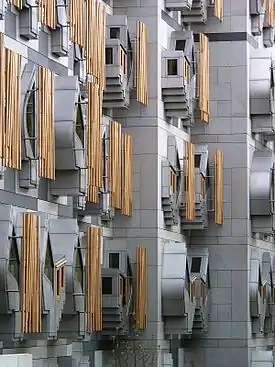 Image 19The Scottish Parliament Building (Scottish Gaelic: Pàrlamaid na h-Alba, Scots: Scots Pairlament Biggin) is the home of the Scottish Parliament at Holyrood, within the UNESCO World Heritage Site in central Edinburgh. It was designed by Enric Miralles, the Catalan architect,.and has won a number of awards, including an award at the VIII Biennial of Spanish Architecture, the RIAS Andrew Doolan Award for Architecture, and the 2005 Stirling Prize, the UK's most prestigious architecture award.Photo credit: Wangi