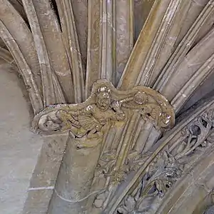 Detail of porch sculpture; devils and monsters