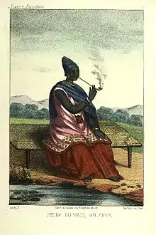 Image 9The Queen of Waalo - Lingeer Ndaté Yalla Mbodj (1810–1860) in her royal dress, seating and smoking a pipe.Credit: Llanta. Lithographer, Abbot P. David Boilat, author of text in his book Esquisses sénégalaises (1853). Source: cote : Gallica, bnf.fr - Réserve DT 549.2 B 67 M Atlas - planche n °5 - Notice n° : FRBNF38495418 - (Illustrations de Esquisses sénégalaises). Uploader to Wiki Commons Patricia.fidiMore about Ndaté Yalla Mbodj...