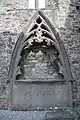 a late gothic canopy tomb in a niche of the wall