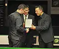 Runner-up Stephen Maguire getting his award.