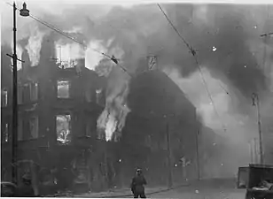 NARA copy #27, IPN copy #23Destruction of a housing blockZamenhofa Street looking North, with burning Zamenhofa 25 / Wołyńska 2 on the left.