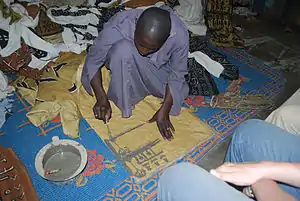 Image 22A textile artisan at work in Djenne, Mali. (from Culture of Mali)