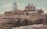 Iron Pot lighthouse with the Parkinson family home, circa 1910