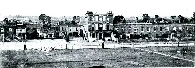 Turnham Green north side with smithy and Crown and Anchor pub (before it was rebuilt), 1863