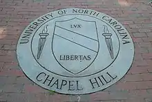 A seal for a school that contains the name and the date of founding.