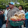 Street vendor in Maracaibo with improvised carry container